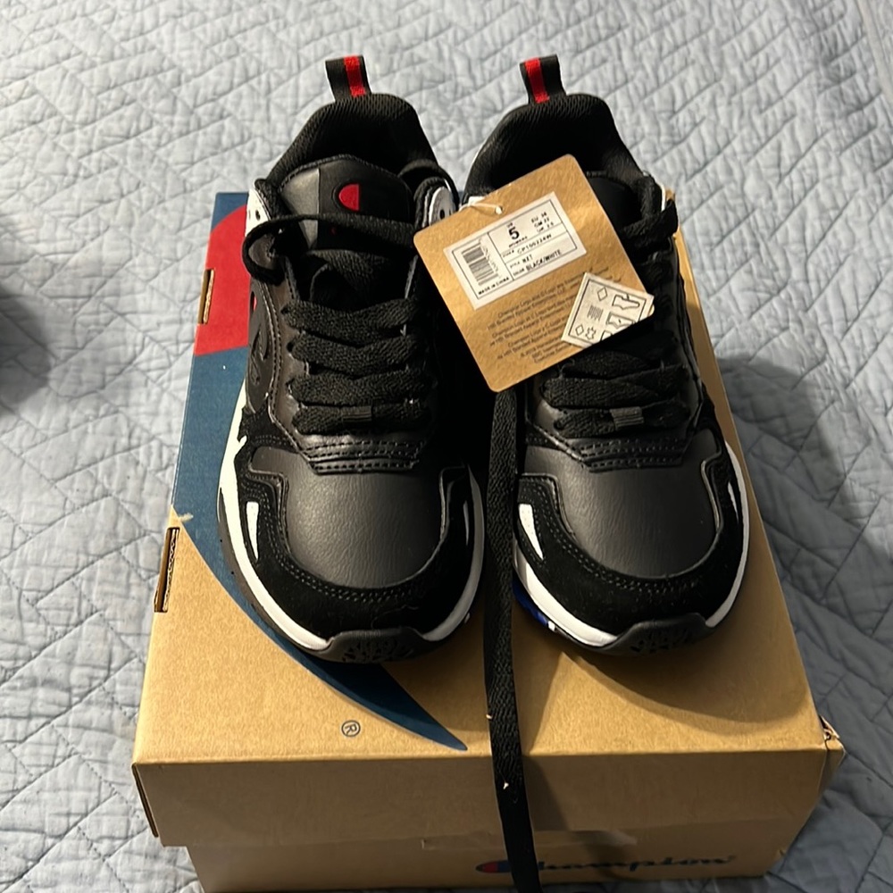 Brand new Champion black and white sneakers